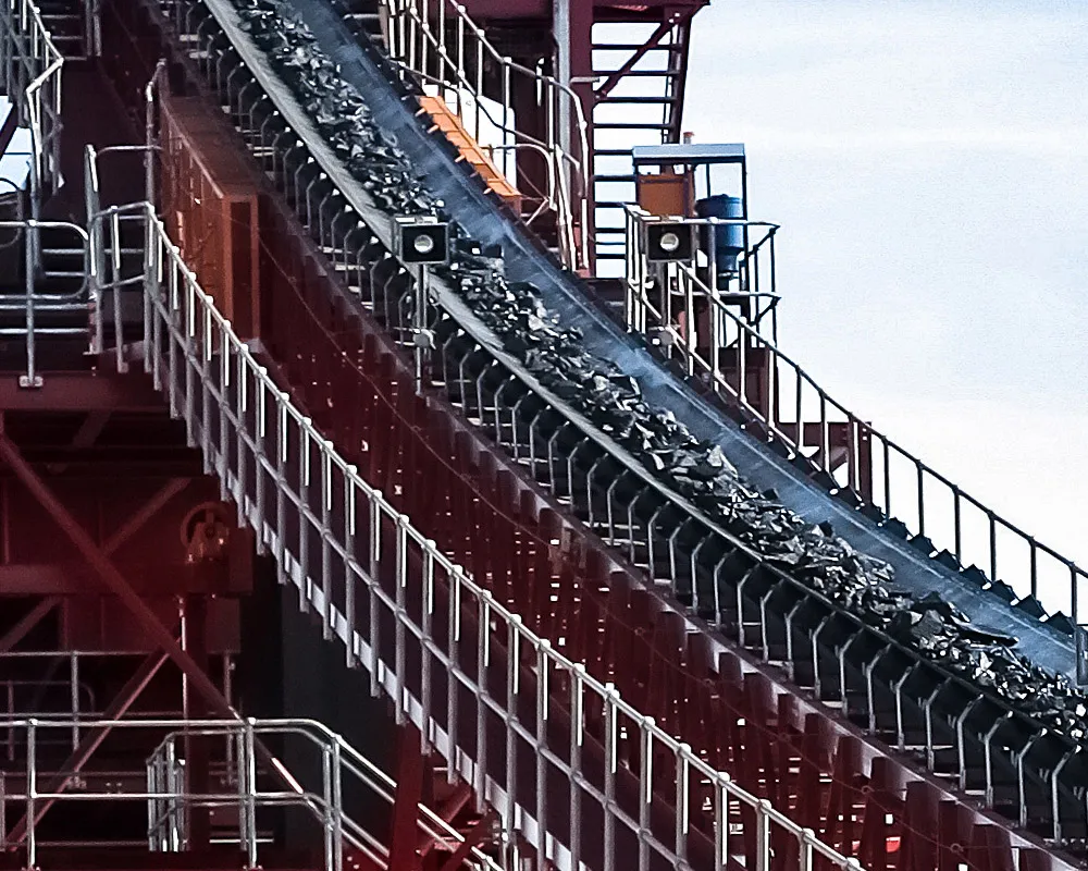 A material conveyor on a steel conveyor bridge at an industrial plant